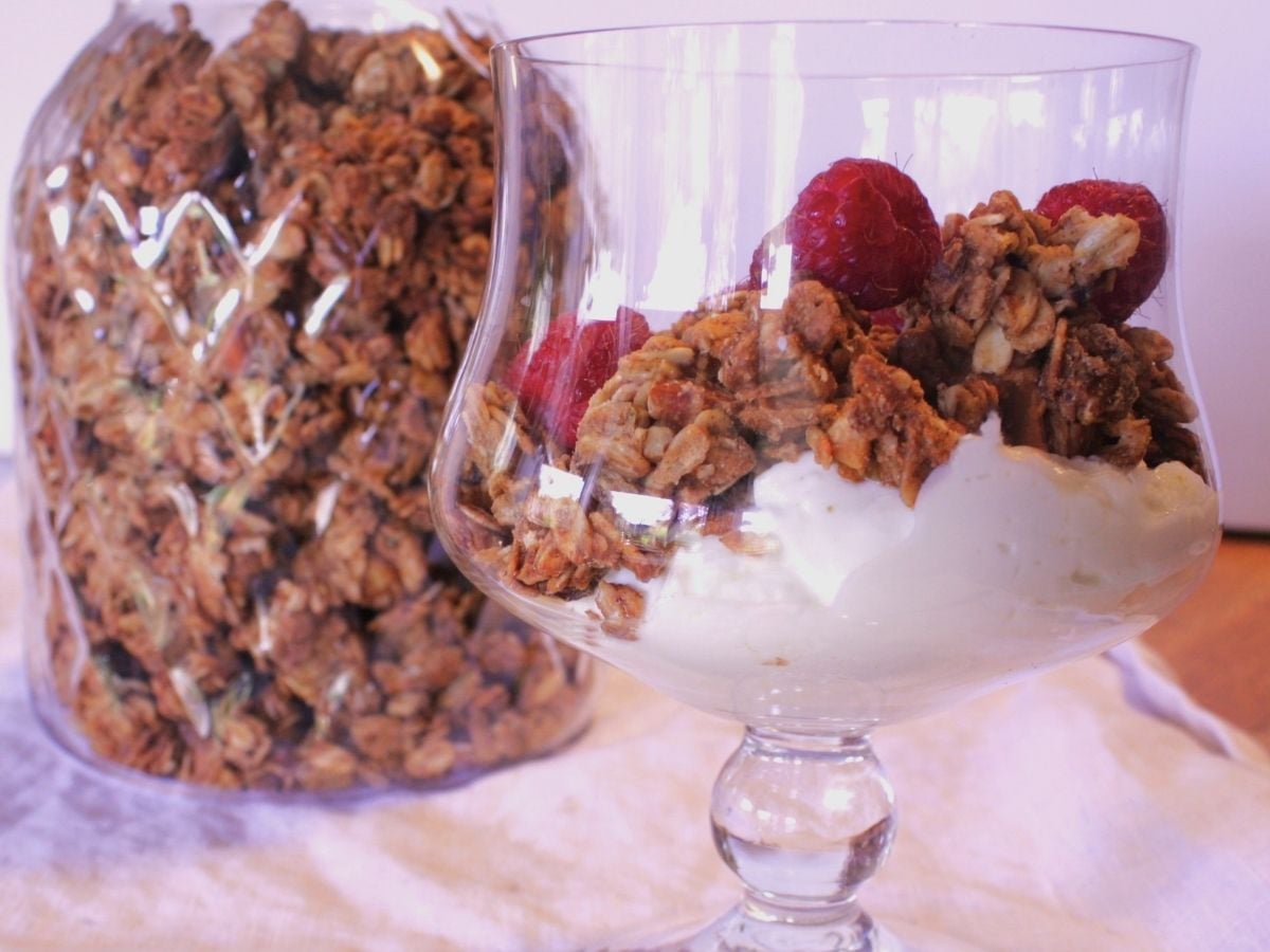 chunky granola yogurt topped with fresh raspberries