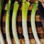 5 leeks with a knife