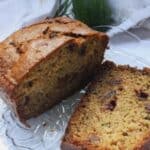 zucchini bread on a plate that is sliced