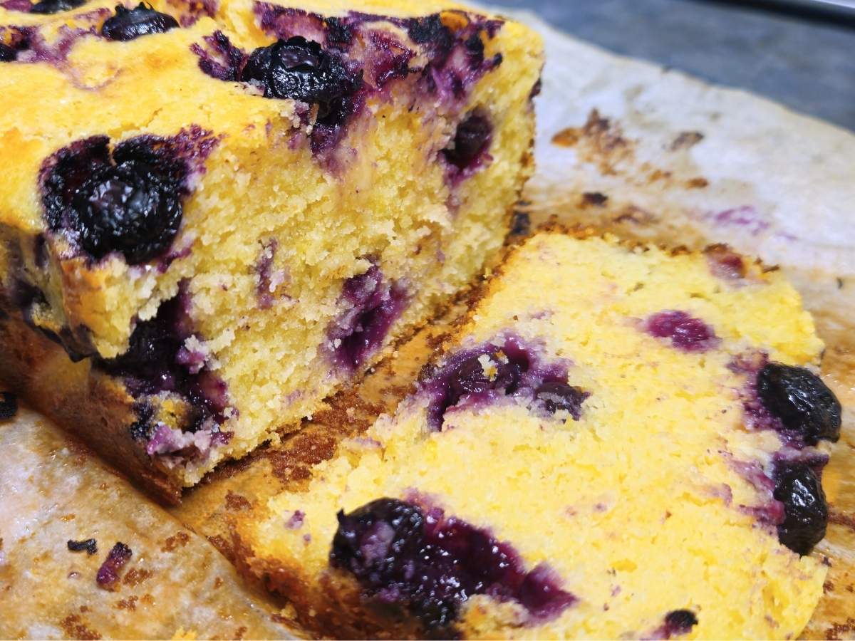 a slice blueberry lemon loaf