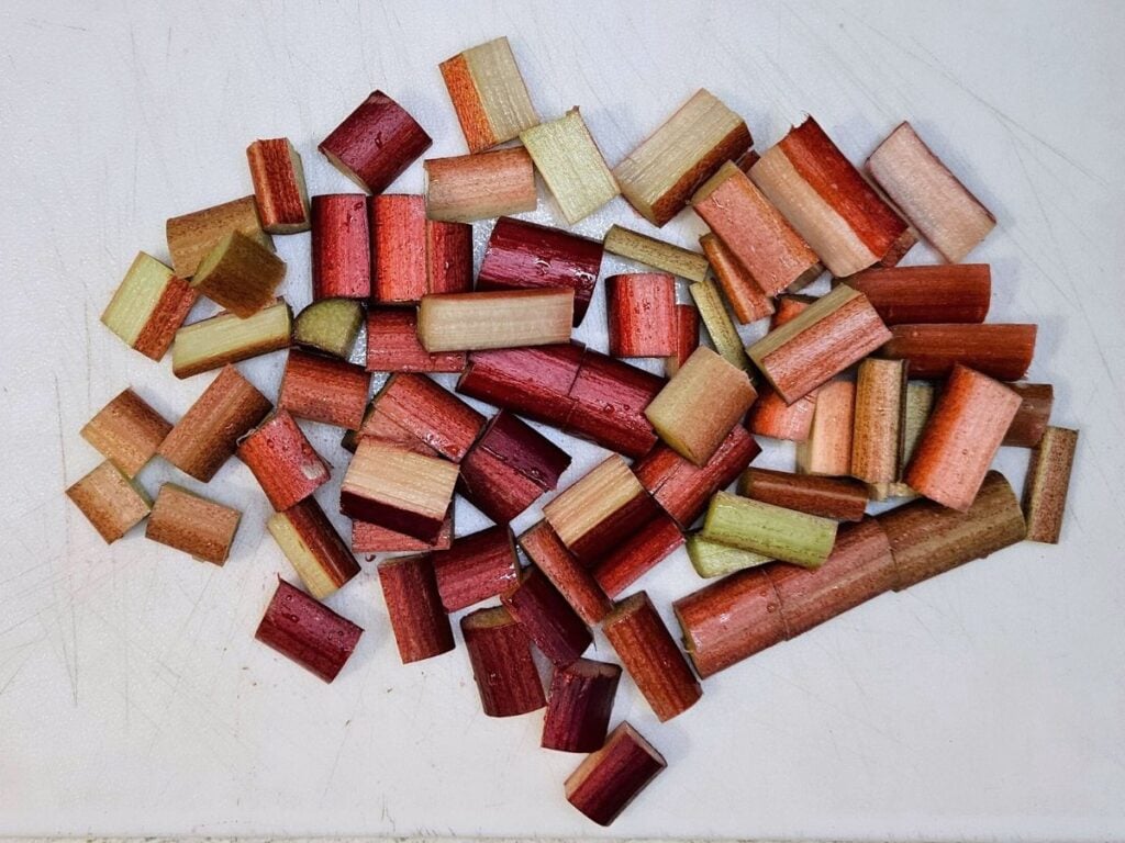 chopped up rhubarb on chopping board