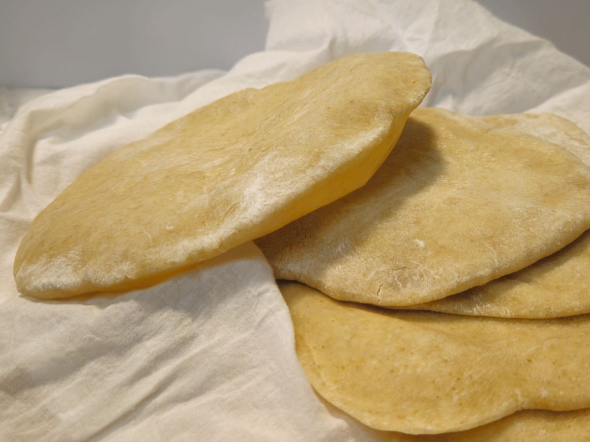 a pile of sourdough pita bread