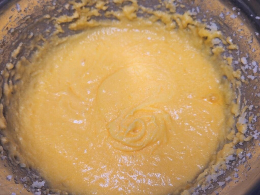 all of the wet ingredients for almond flavored cupcakes mixed together