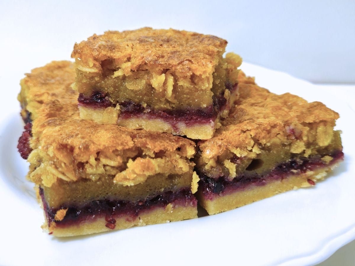 three blackberry oat squares on a plate