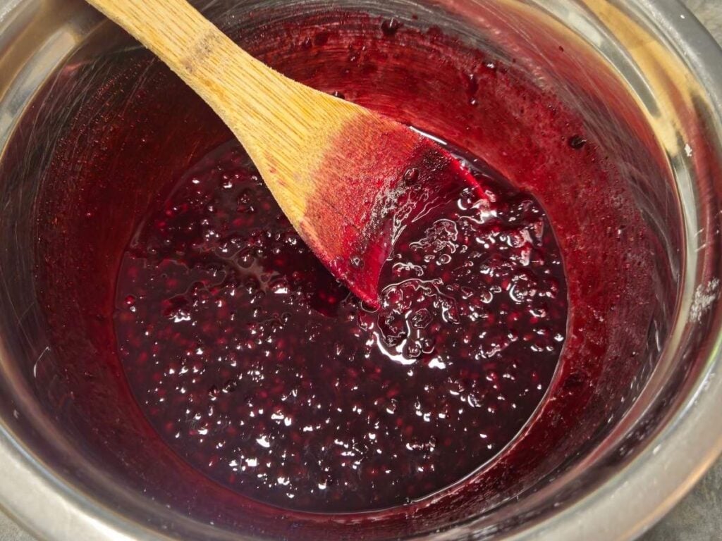 a bowl with blackberry jam filling