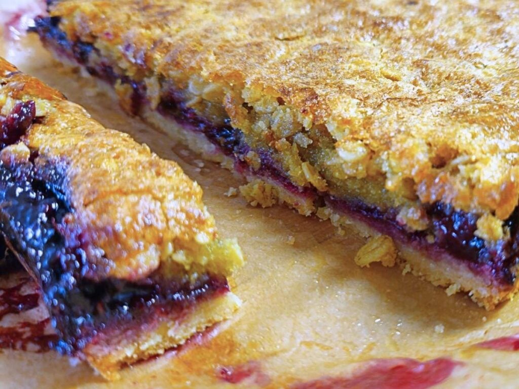 close up of blackberry oat squares before sliced