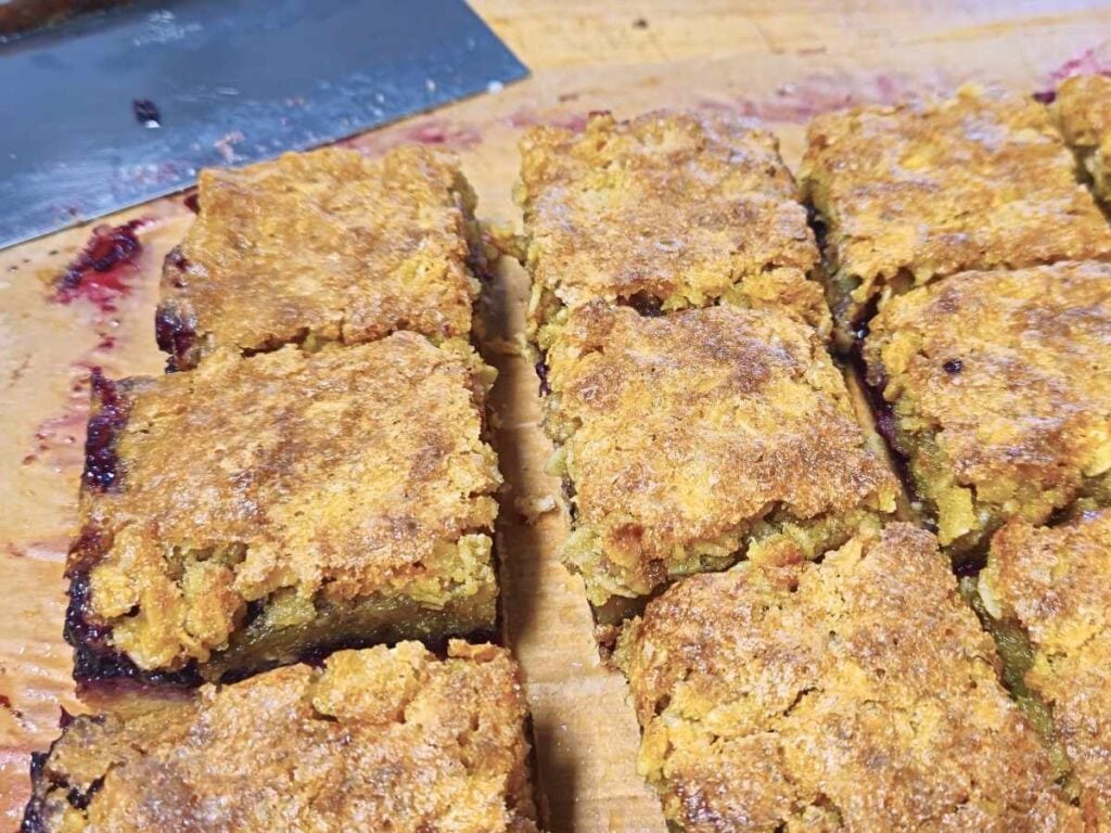 blackberry oat squares on a chopping board