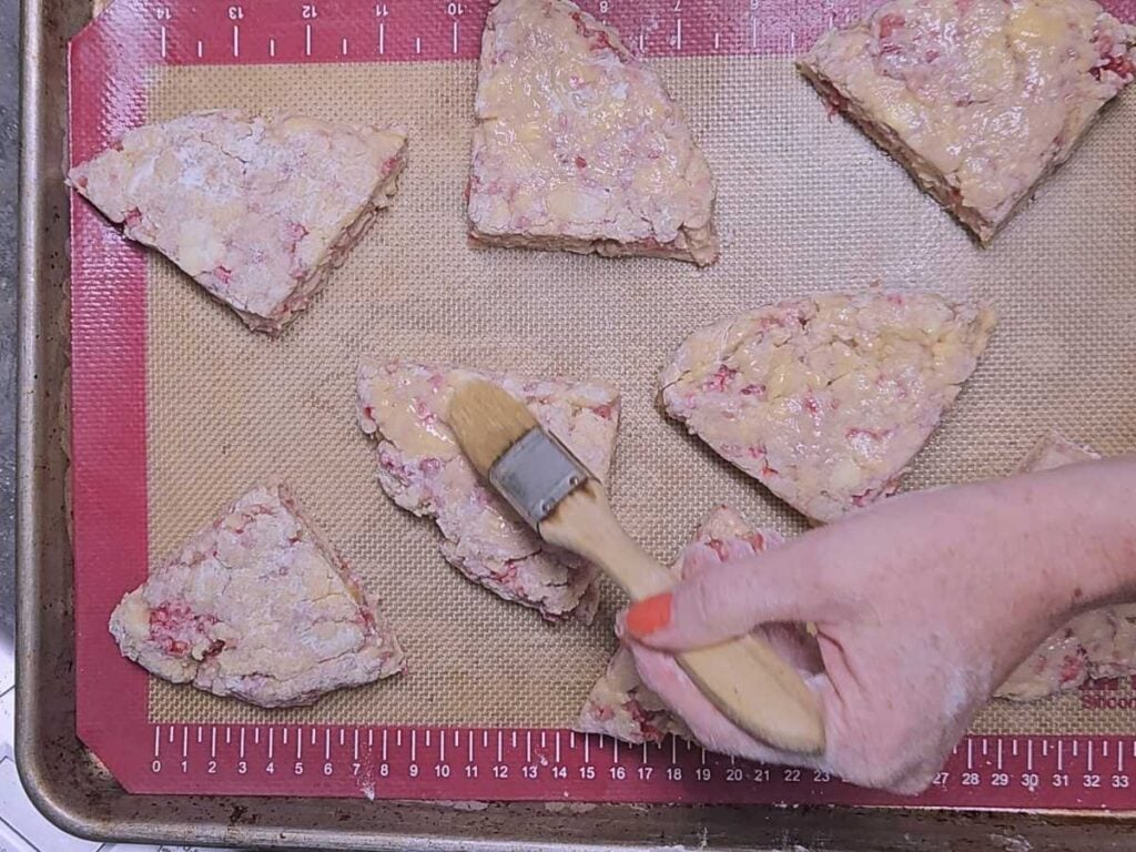 brushing scones with leftover egg and milk