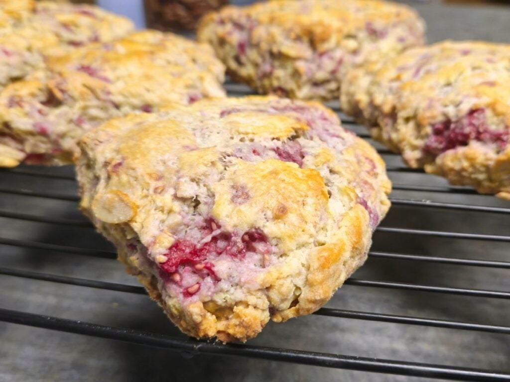almond raspberry scones on a cooling rack