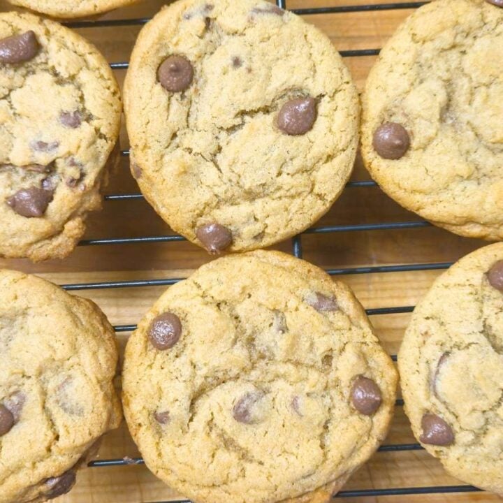 six chocolate chip cookies on a cooling rack