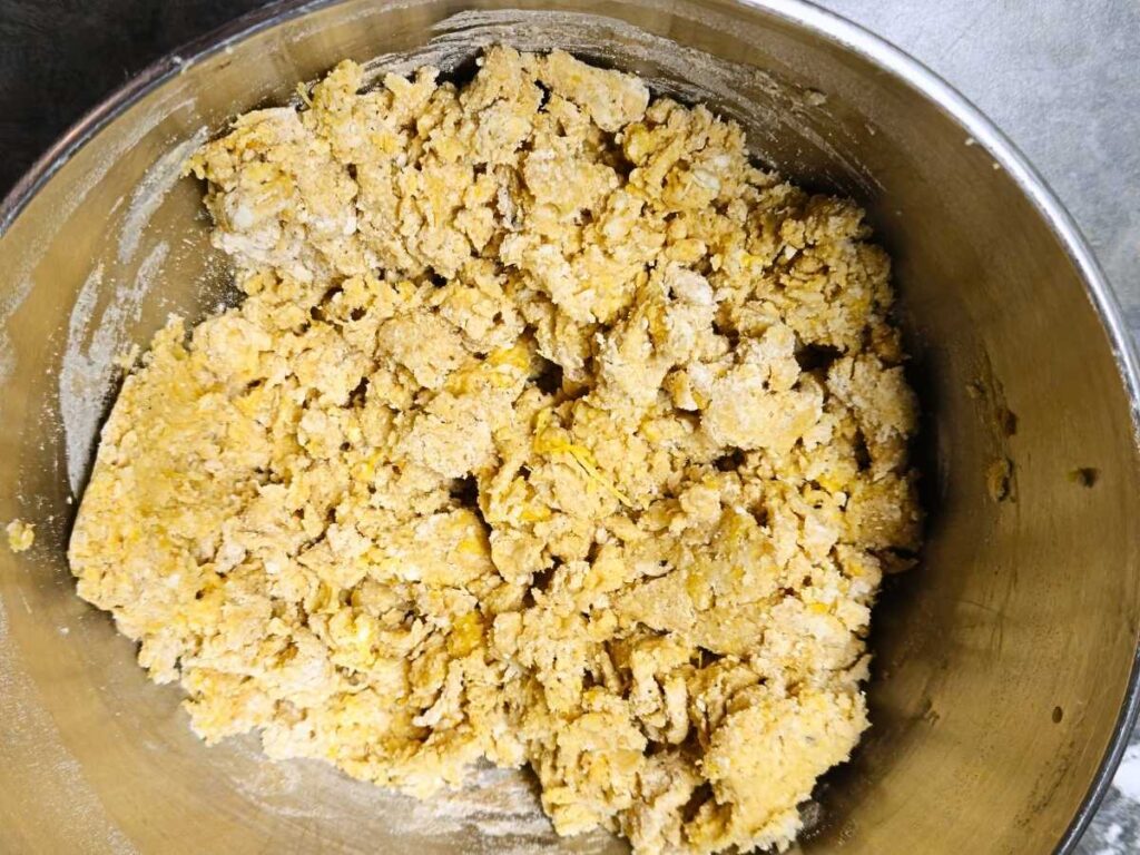 rough dough in a mixing bowl for a scone recipe